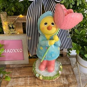 Beautiful Spring Duck in Raincoat with Tulip